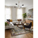 Green and ivory traditional Oushak rug staged in a living room