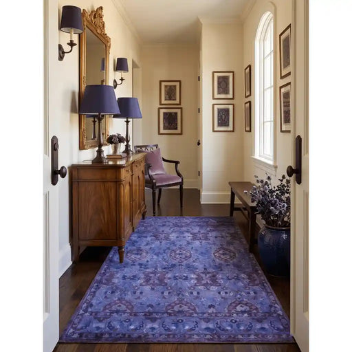 Traditional patterned area rug shown lengthwise in a furnished hallway