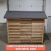 Cedarshed bayside lean to storage shed kit with metal roof in front of a garage.