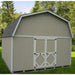 Beige little cottage co large barn with a osb roof in a green outdoor setting