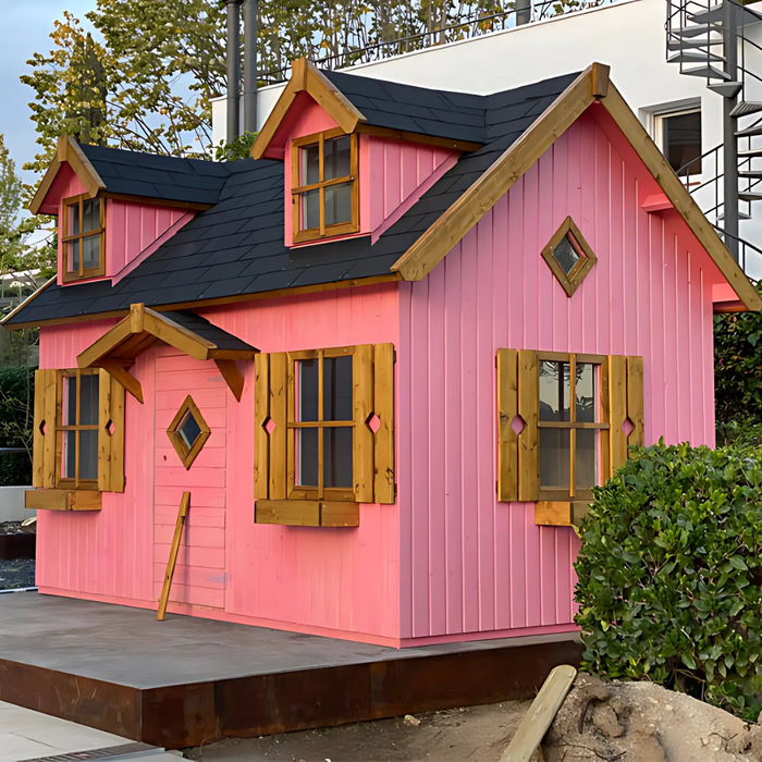 Pink palmako marie 9x6 playhouse kit with black roof and wooden shutters in an outdoor setting