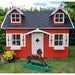 Palmako Marie 9x6 red playhouse kit with a black roof and white trim, with a rocking horse and flowers in front