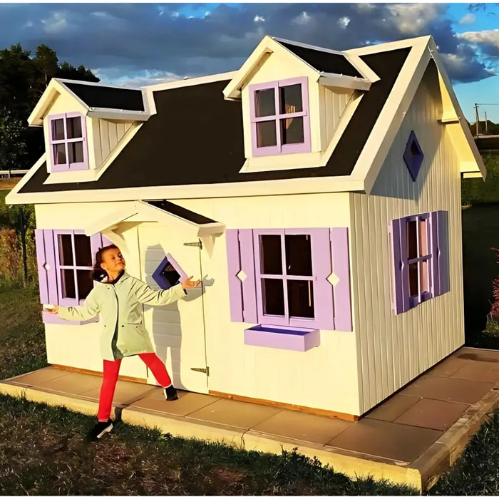 Child standing in front of a palmako marie 9x6 playhouse with purple shutters and black roof