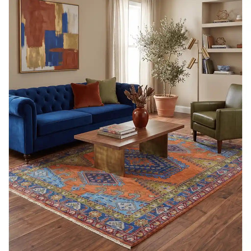Lifestyle view of rug partly placed under furniture