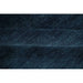 Close-up side profile of the wool pile on the Midnight Blue hand-knotted rug