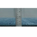 Ruler placed along the rug edge as a thickness reference