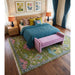 Hand-knotted rug staged beneath a bed and bench