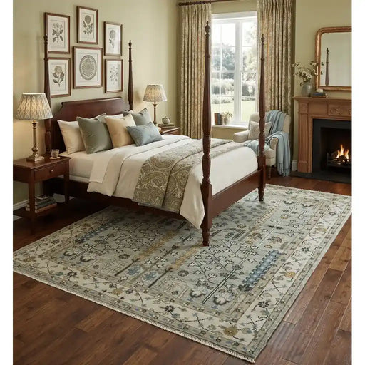 Moss Green and Ivory Tree of Life rug styled beneath a bed