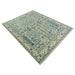 Angled full view of the Moss Green and Ivory rug