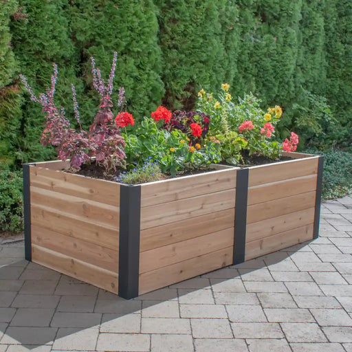 Outdoor Living Today 6x3 Urban Raised Garden Bed with flowers against a green hedge background
