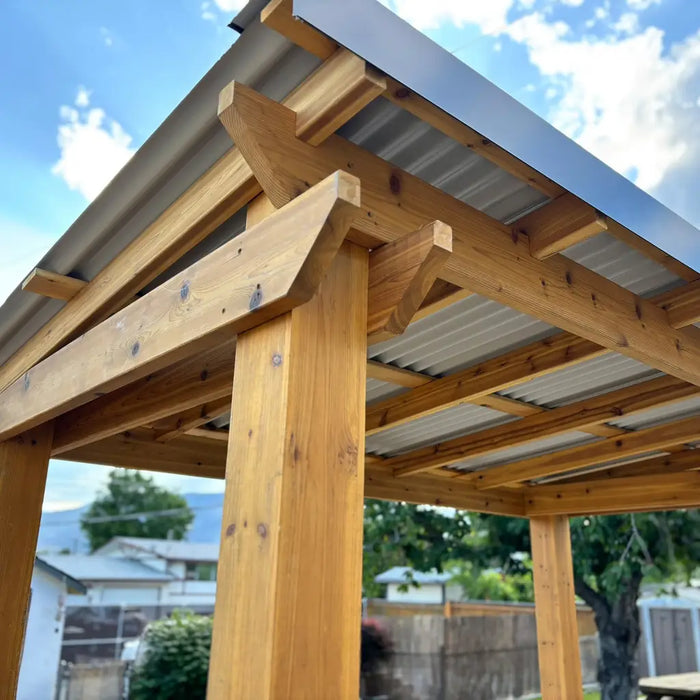 Outdoor Living Today 8x5 Grill Gazebo roof against a blue sky