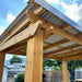 Outdoor Living Today 8x5 Grill Gazebo roof against a blue sky