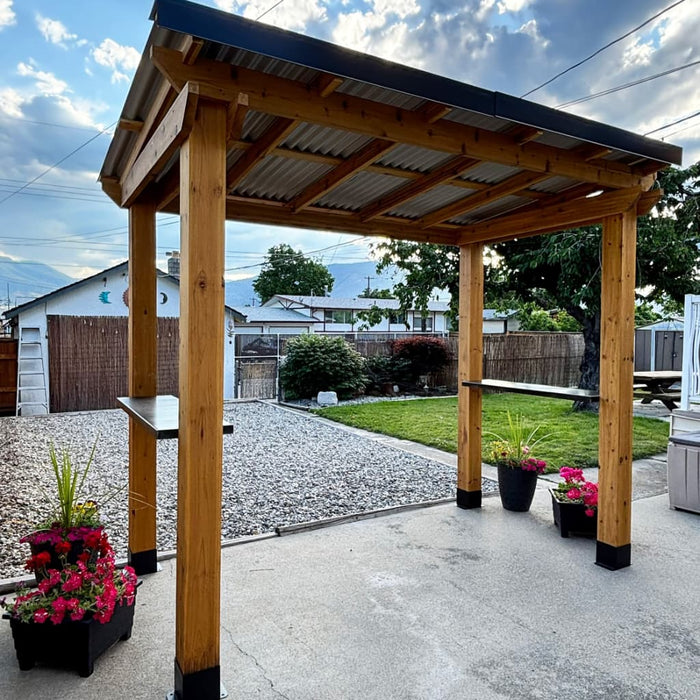 Outdoor Living Today 8x5 Grill Gazebo with plants on a patio area