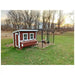 Classic red OverEZ Large Chicken Coop connected to a chicken run in a field.