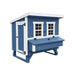 Blue Coastal OverEZ Large Chicken Coop front view with man door and nesting box.