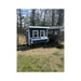 Blue Large Chicken Coop with an attached customer run in a wooded yard