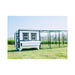 Blue Coastal OverEZ Large Chicken Coop installed beside a chicken run in a field.