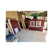 Large Chicken Coop wall panels staged under a carport before customer assembly