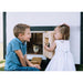 Children meeting chicks at the chicken door of a Farmhouse OverEZ Large Chicken Coop.