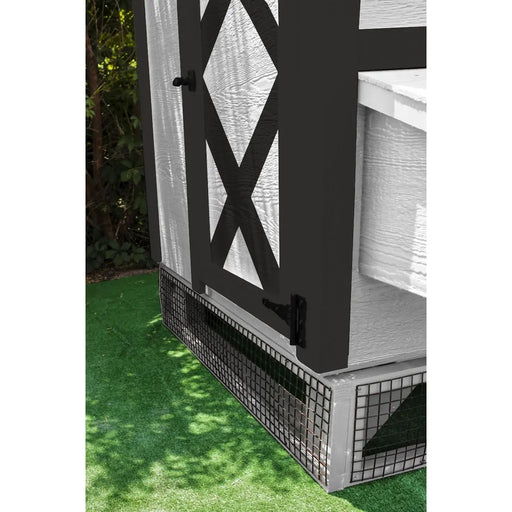 White OverEZ Large Chicken Coop with wire panels beneath the side door.