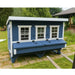 OverEZ XL Coastal Chicken Coop installed in a green backyard.