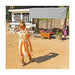 Chicken keeper standing beside an OverEZ XL Chicken Coop in a backyard.