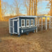 OverEZ XL Farmhouse Chicken Coop installed in an autumn backyard.