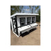 OverEZ XL Farmhouse chicken coop with white siding, dark trim, three front windows, nesting box lids, and a left-side entry door.