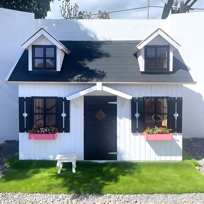 Small white palmako marie 9x6 playhouse with black shutters and a blue door, featuring two small windows on the roof.