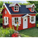 Red palmako marie 9x6 wood playhouse kit with white trim in a garden setting