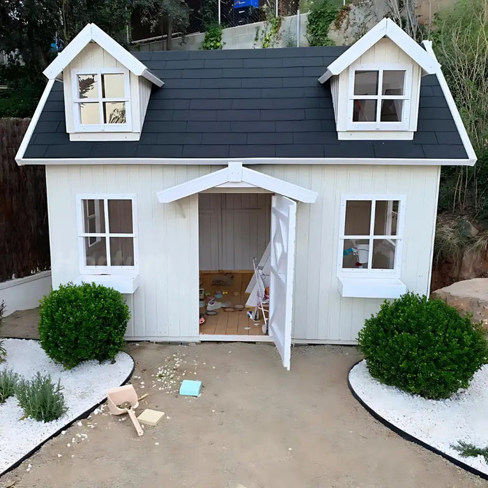 White palmako 9x6 marie playhouse with black roof in a garden setting