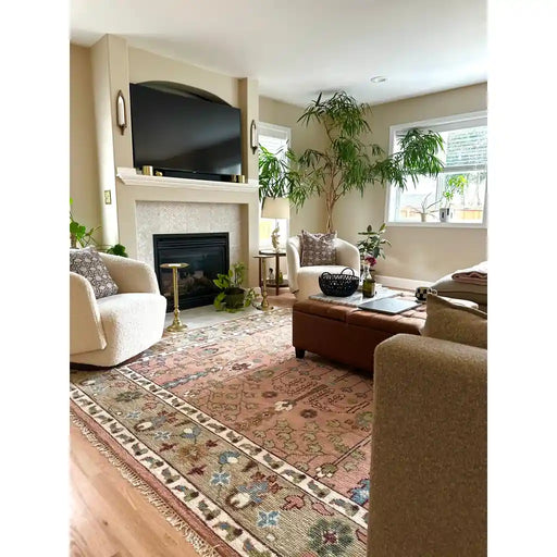 Pink, Olive and Beige hand-knotted wool rug, shown in room