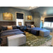 Royal Green and Ivory rug centered in a room with twin beds