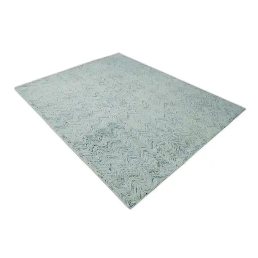 EVE001 blue and ivory rug shown at a diagonal angle