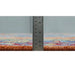 Low-profile rug edge beside a ruler reference