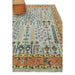 Angled view of the rug end with its rust border shown in a room-floor setting