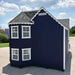 Navy blue Sara's Victorian Playhouse Kit with white trim on a clear day