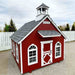 Little Cottage Co Stratford Schoolhouse playhouse kit with a bell tower on a gravel surface