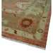 Close view of the rug corner, border, and fringe