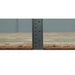 Ruler placed beside the edge of the hand-knotted wool rug