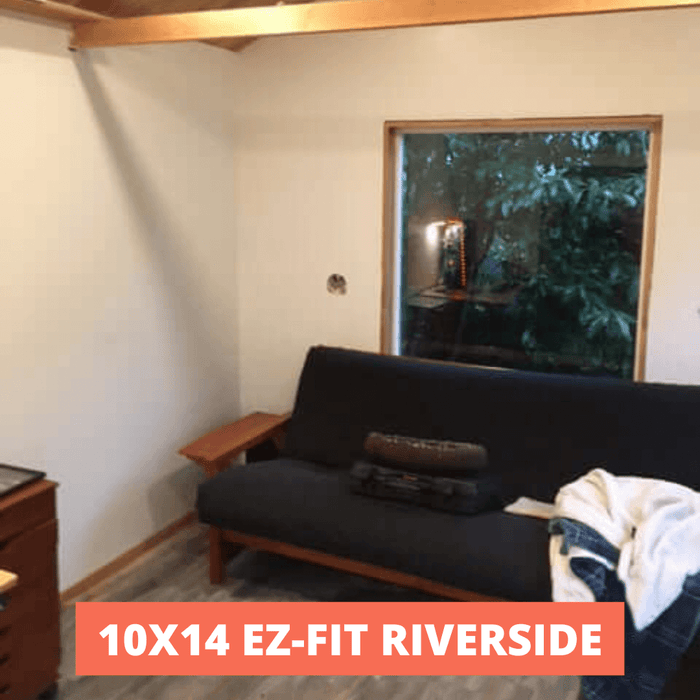 Interior of 10x14 EZ-Fit Riverside shed kit with window, futon, and wooden beams, highlighting spacious shed design for storage or living